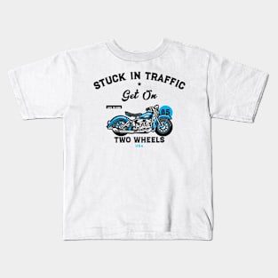 MOVING THROUGH TRAFFIC ON TWO WHEELS Kids T-Shirt